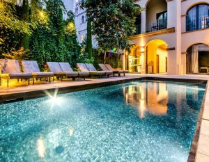 cycling girona hotel nord 1901 superior outdoor swimming pool night 300x233 1