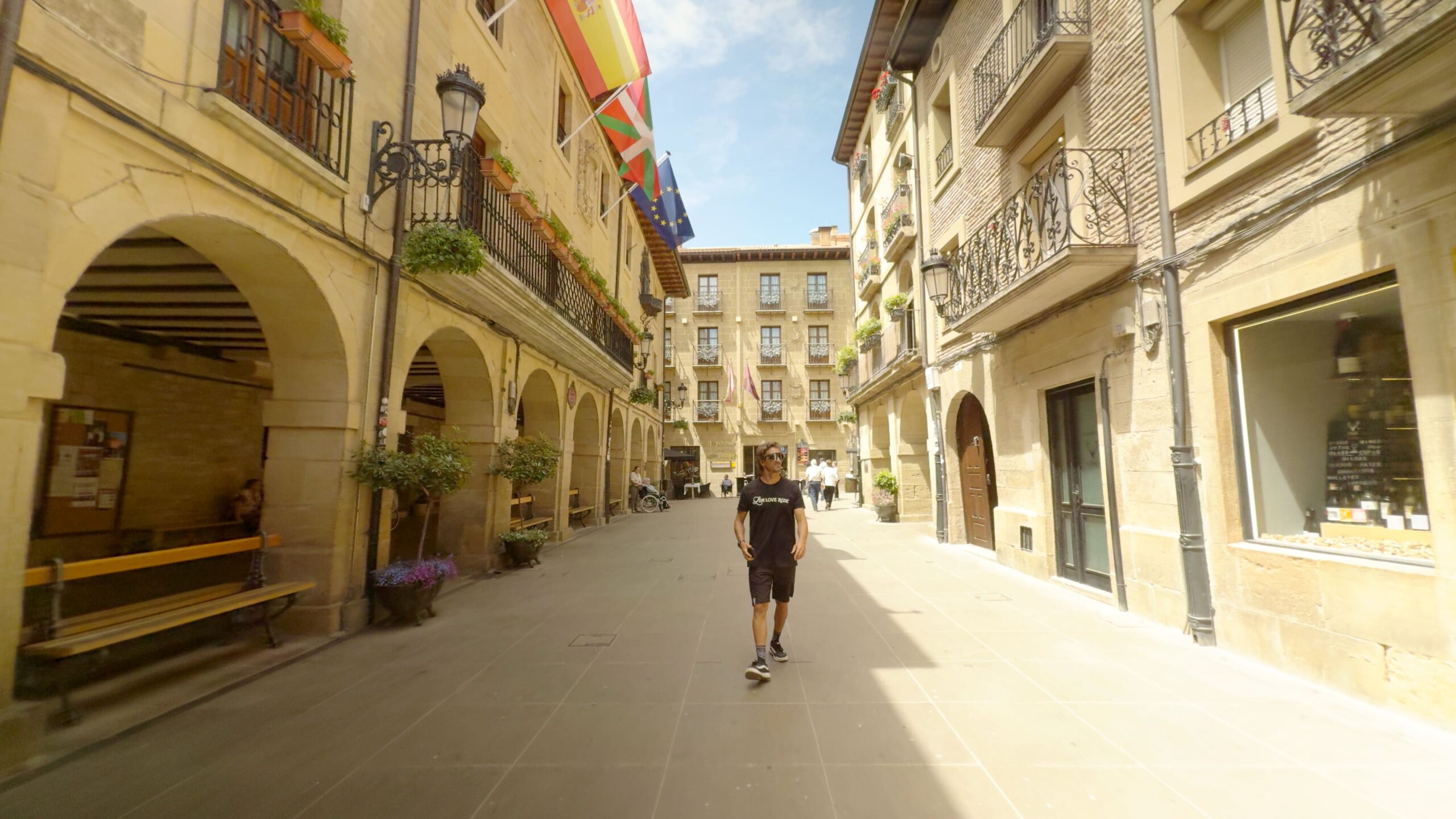 Cyclist exploring the historic streets of Laguardia in La Rioja, Spain.