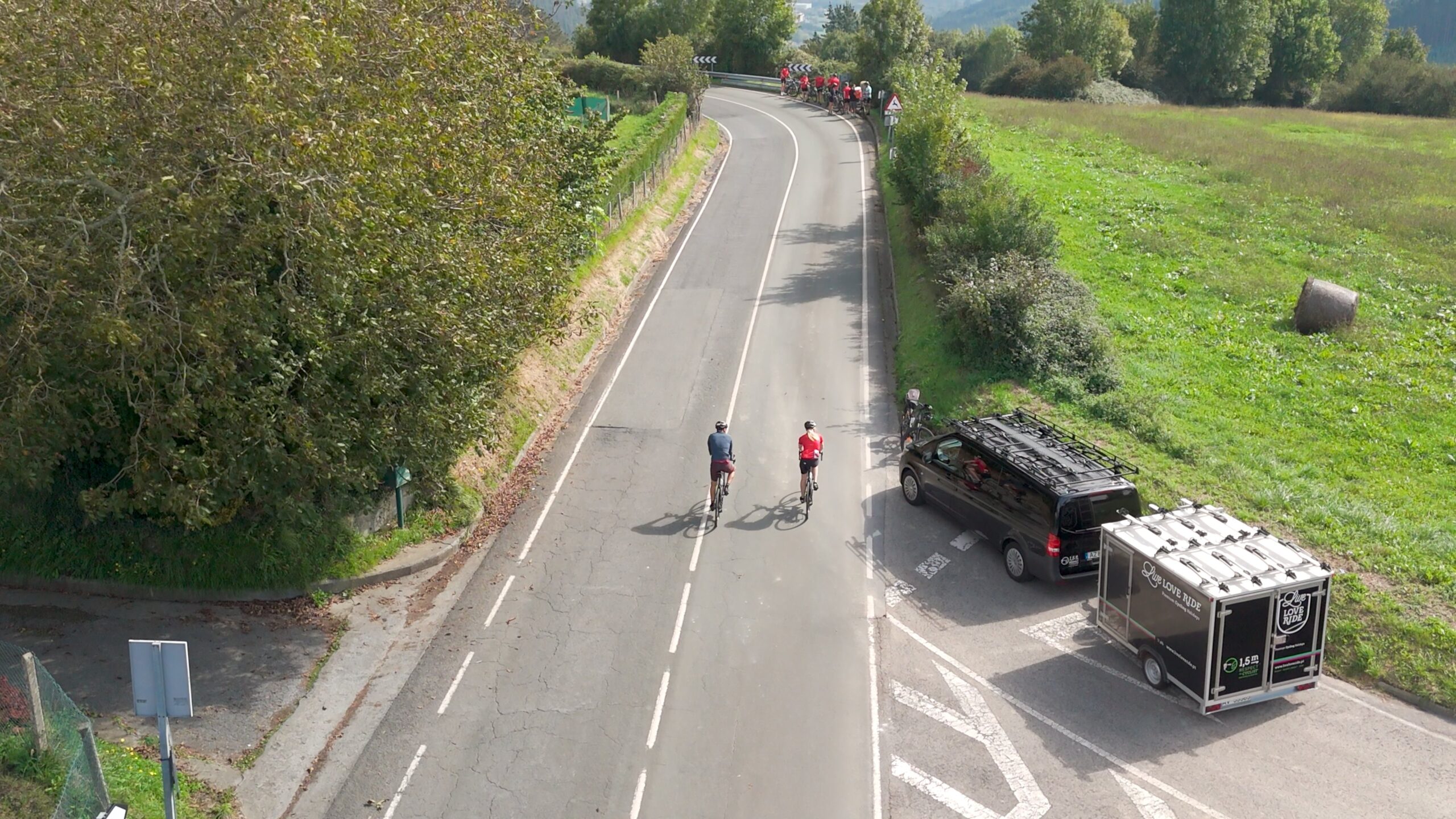 Support van and group on a bike tour in the basque country
