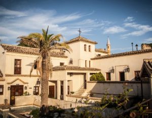 cycling spain andalucia hospederia del monasterio building terrace room access 300x233 1